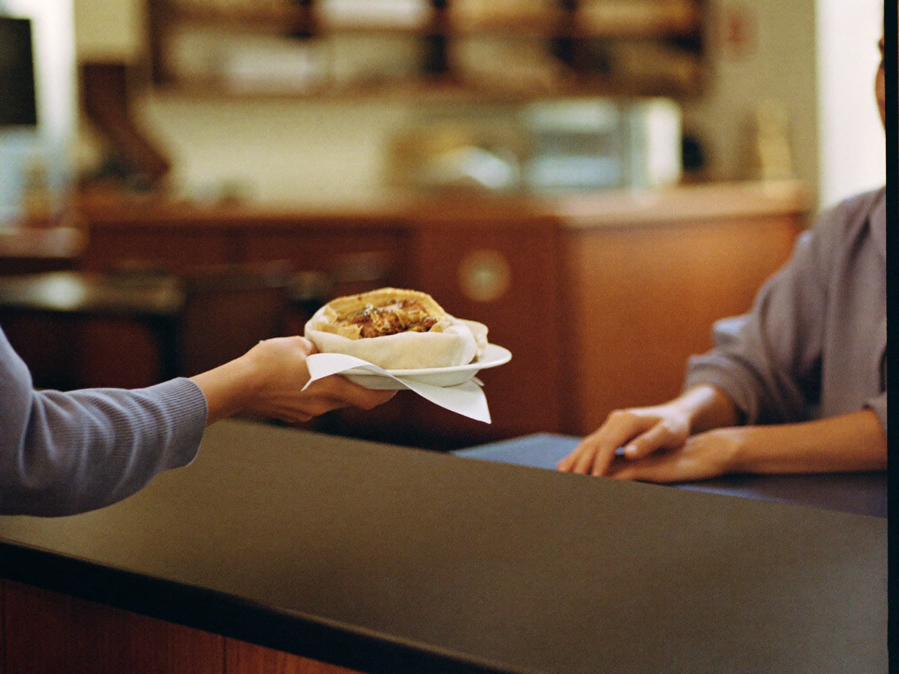 A meal being passed across the counter